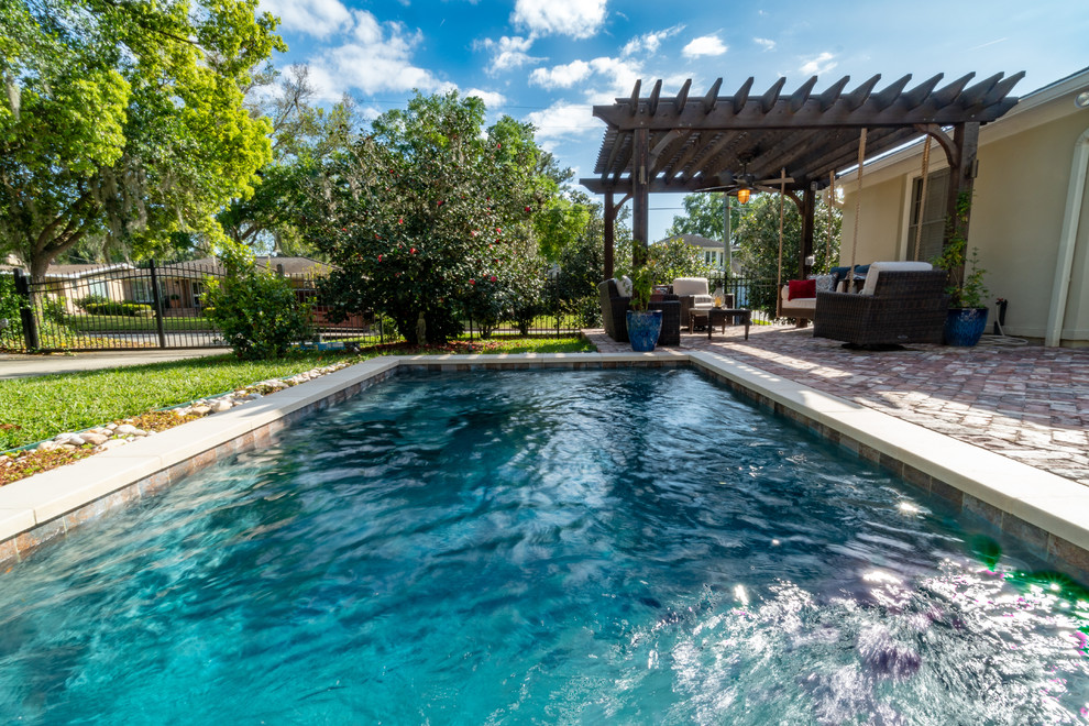 Design ideas for a medium sized rustic swimming pool in Jacksonville.