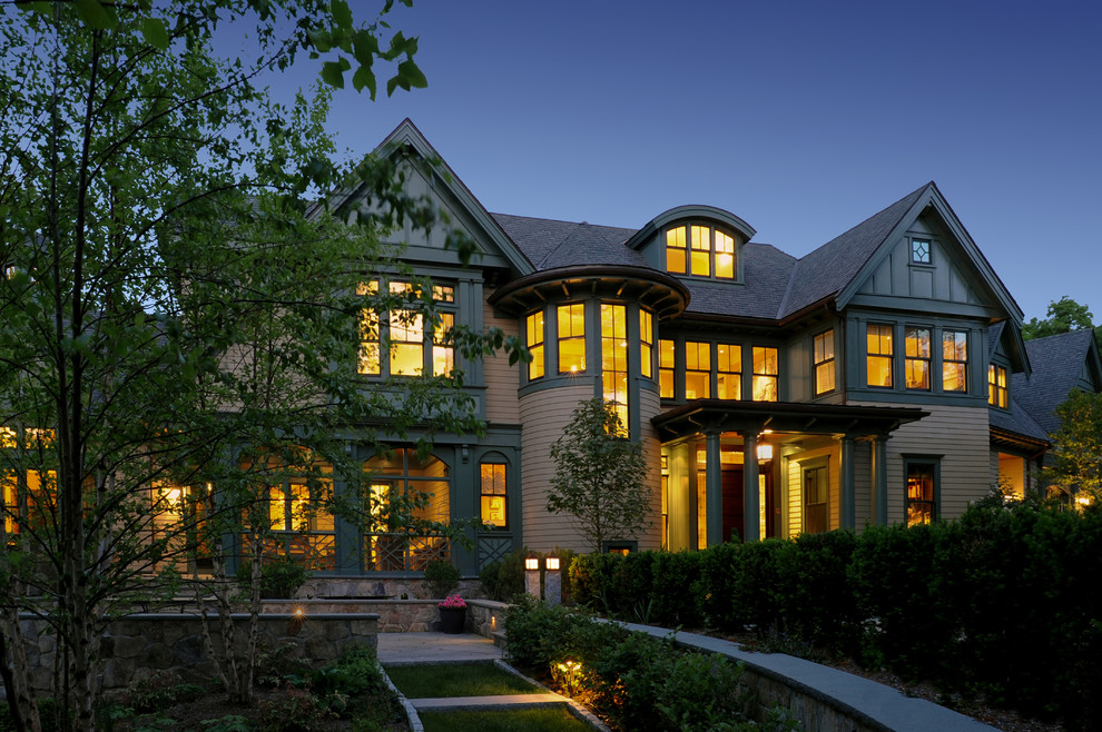 Design ideas for a beige victorian house exterior in Boston with wood cladding.