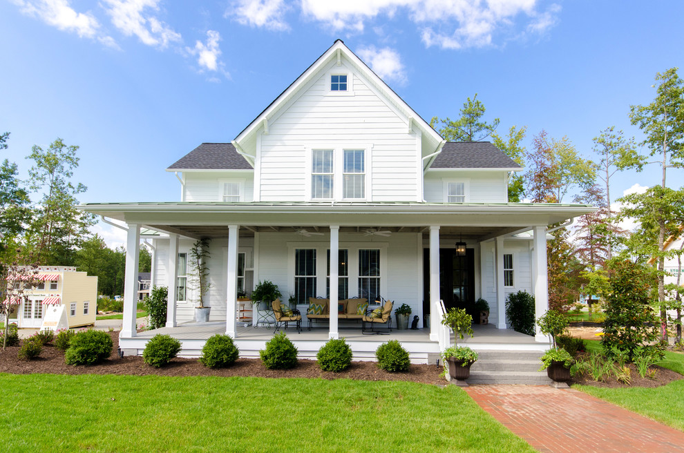 Example of a cottage white two-story wood gable roof design in Richmond