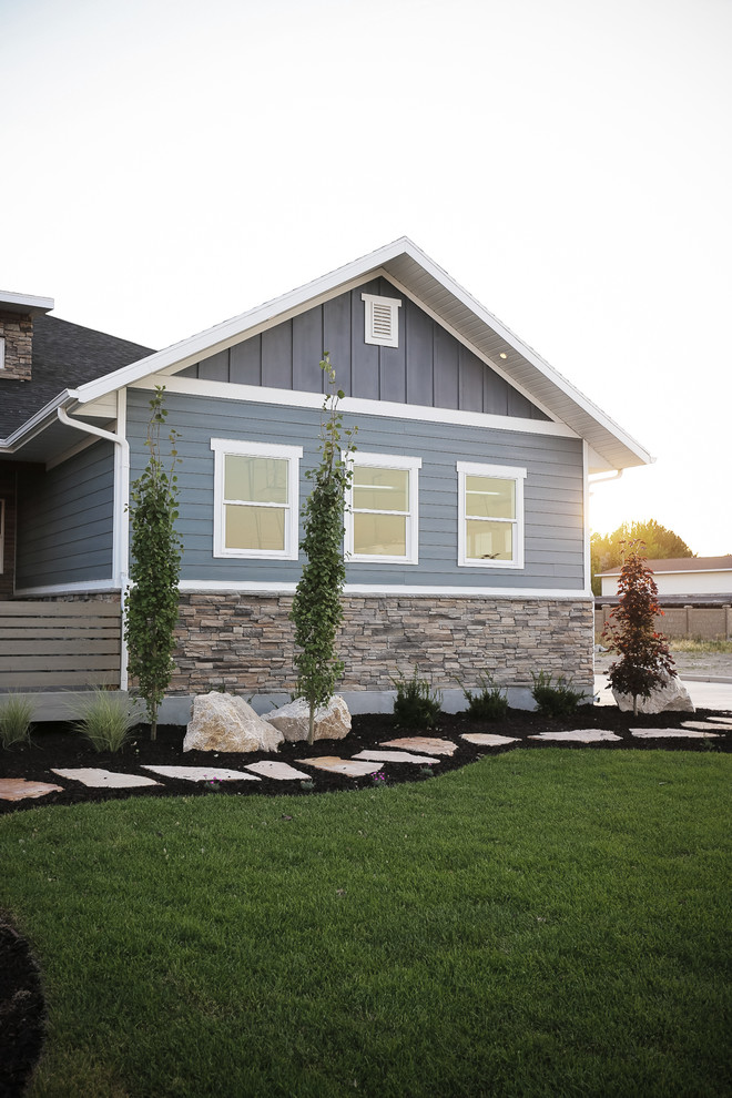 Inspiration for a large timeless blue one-story exterior home remodel in Salt Lake City