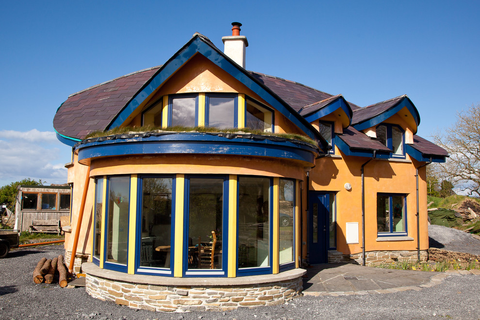 Example of an eclectic two-story exterior home design in Other