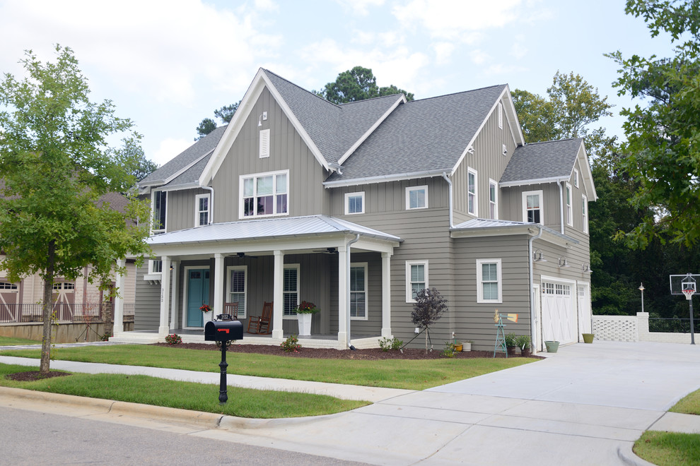 Inspiration for a mid-sized transitional beige three-story vinyl exterior home remodel in Raleigh with a shingle roof