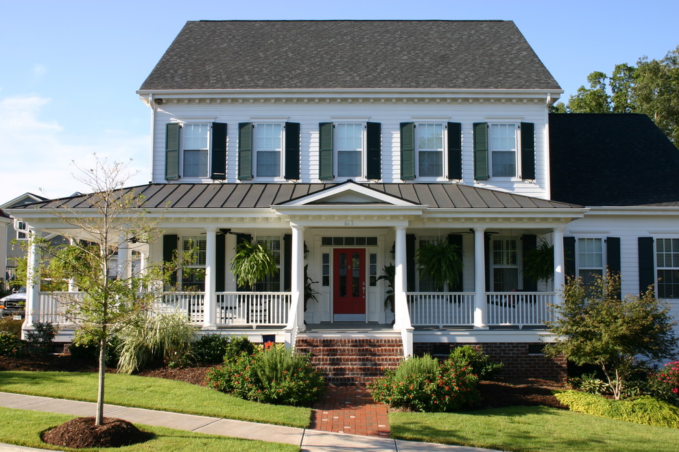 Photo of a medium sized and white classic two floor house exterior in Charlotte with wood cladding, a pitched roof and a mixed material roof.