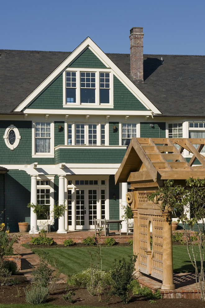 Large ornate three-story wood gable roof photo in Portland