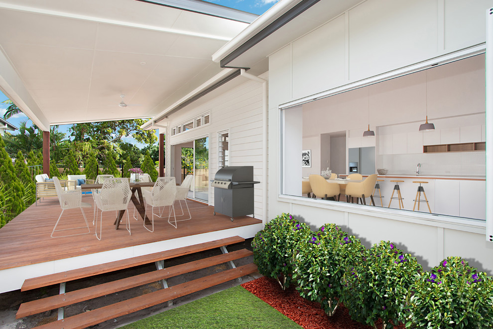 Design ideas for a white nautical bungalow house exterior in Brisbane with concrete fibreboard cladding and a lean-to roof.
