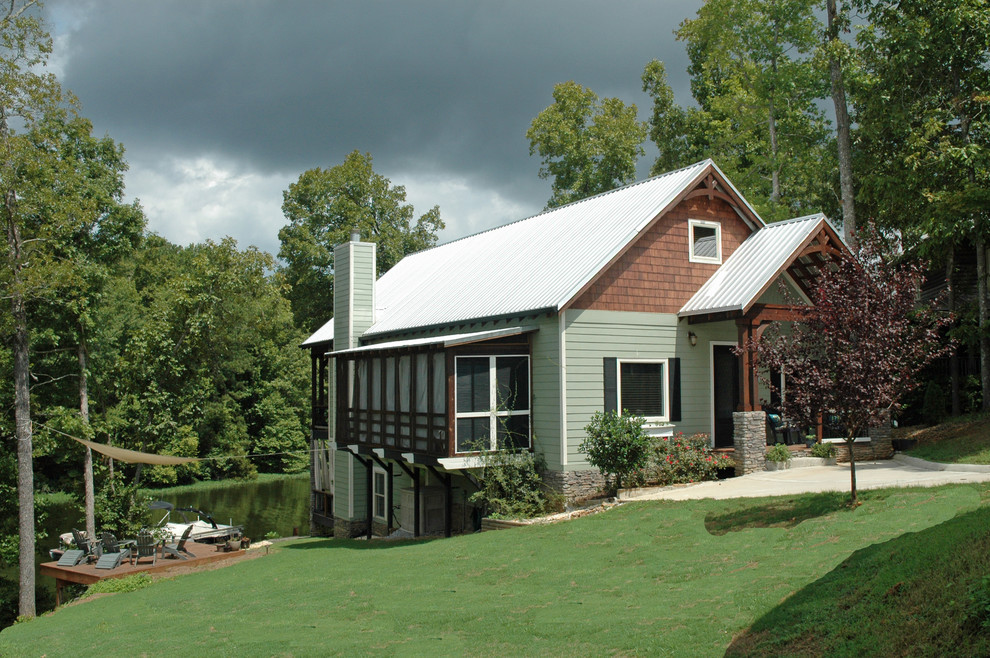 Inspiration for a craftsman green three-story concrete fiberboard exterior home remodel in Birmingham