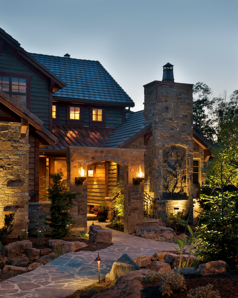 Photo of a classic two floor house exterior in Kansas City with stone cladding.