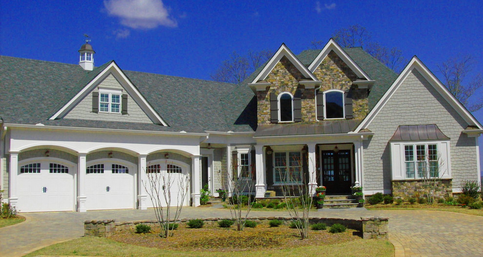 Example of a mid-sized classic multicolored two-story mixed siding gable roof design in Atlanta