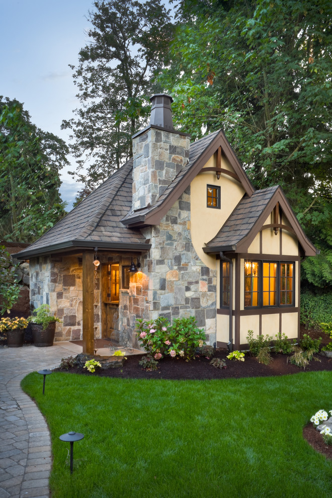 Traditional stone exterior home idea in Portland