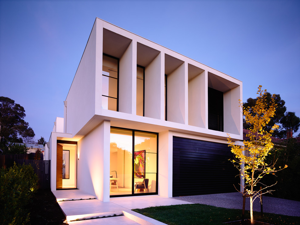 Inspiration pour une façade de maison minimaliste avec un toit plat.