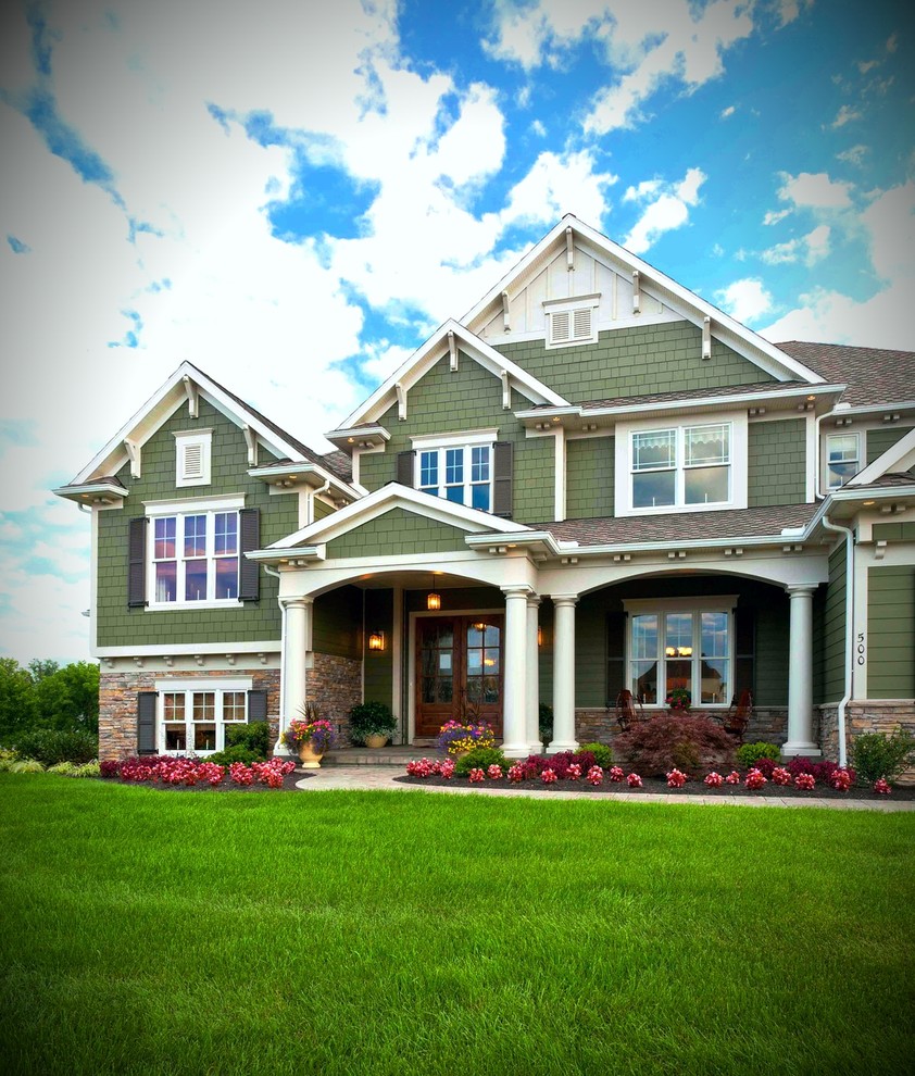 Photo of a large and green classic two floor detached house in Philadelphia with concrete fibreboard cladding, a pitched roof and a shingle roof.