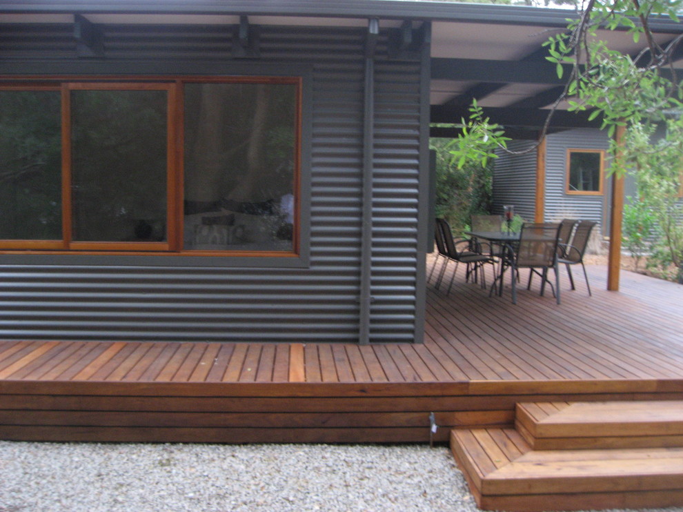 Photo of a small and gey contemporary bungalow detached house in Melbourne with a pitched roof.