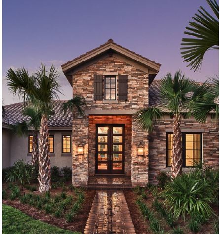 Photo of a medium sized and beige classic bungalow house exterior in Tampa with metal cladding and a pitched roof.