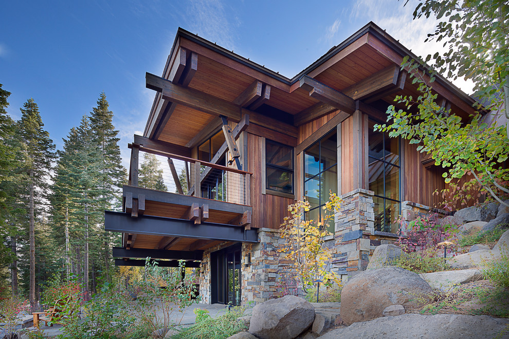 This is an example of a large and brown rustic two floor house exterior in Sacramento with mixed cladding.