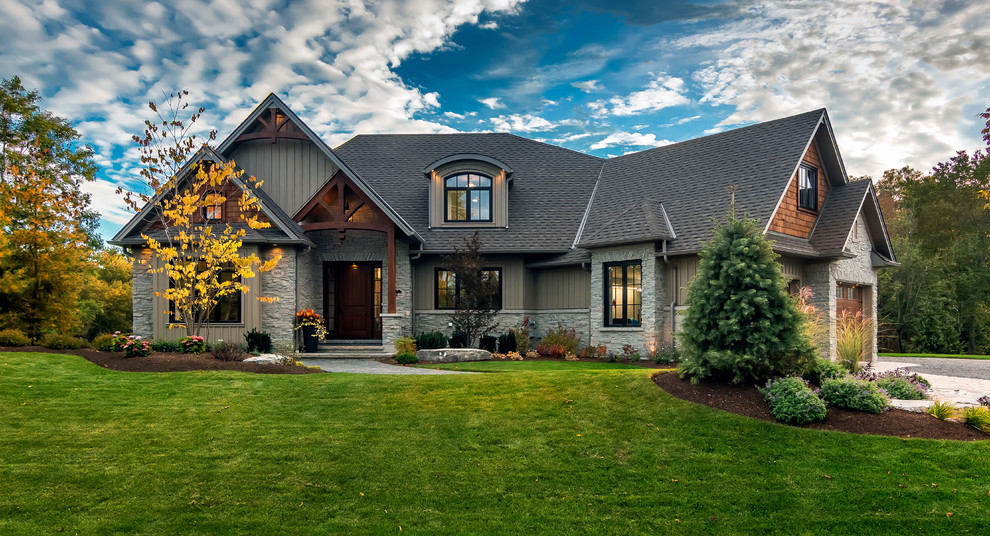 Inspiration for a large and gey classic two floor house exterior in Toronto with mixed cladding and a hip roof.