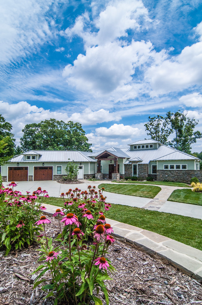 Photo of a blue classic bungalow house exterior in Charlotte.