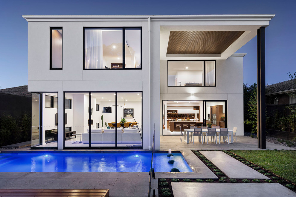 Contemporary white two-story house exterior idea in Melbourne