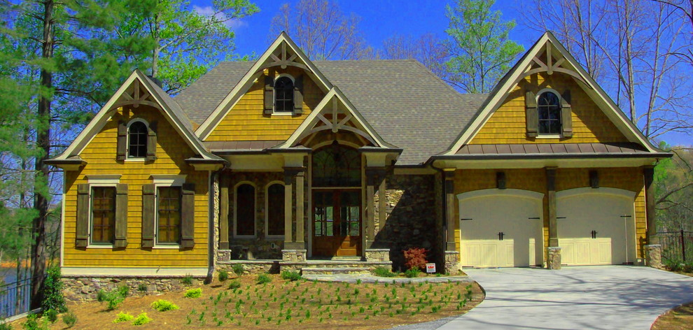 Design ideas for a medium sized and beige traditional two floor house exterior in Atlanta with mixed cladding and a pitched roof.