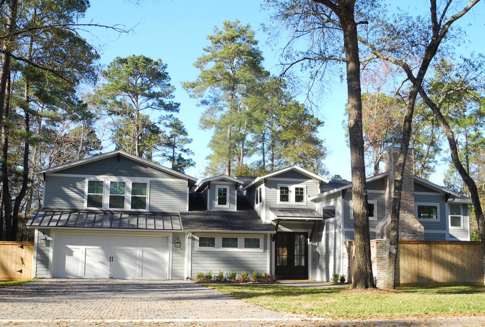 Inspiration for a large craftsman gray two-story mixed siding gable roof remodel in Houston
