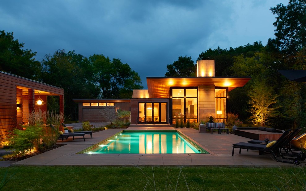 Contemporary bungalow house exterior in Minneapolis with wood cladding and a flat roof.