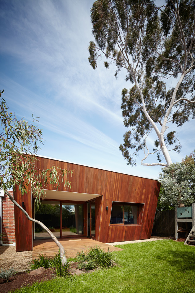 Large contemporary brown one-story wood exterior home idea in Melbourne with a metal roof