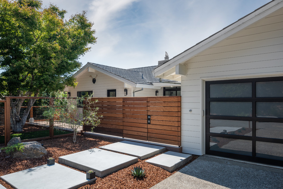 Mid-sized transitional white two-story wood exterior home photo in San Francisco with a metal roof