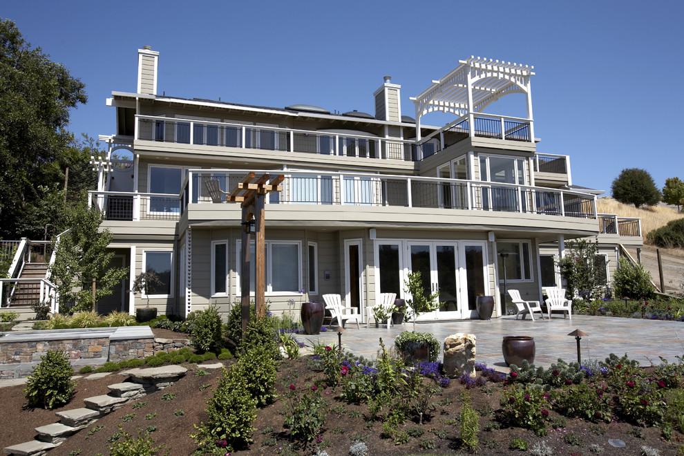 Large contemporary beige three-story wood exterior home idea in San Francisco