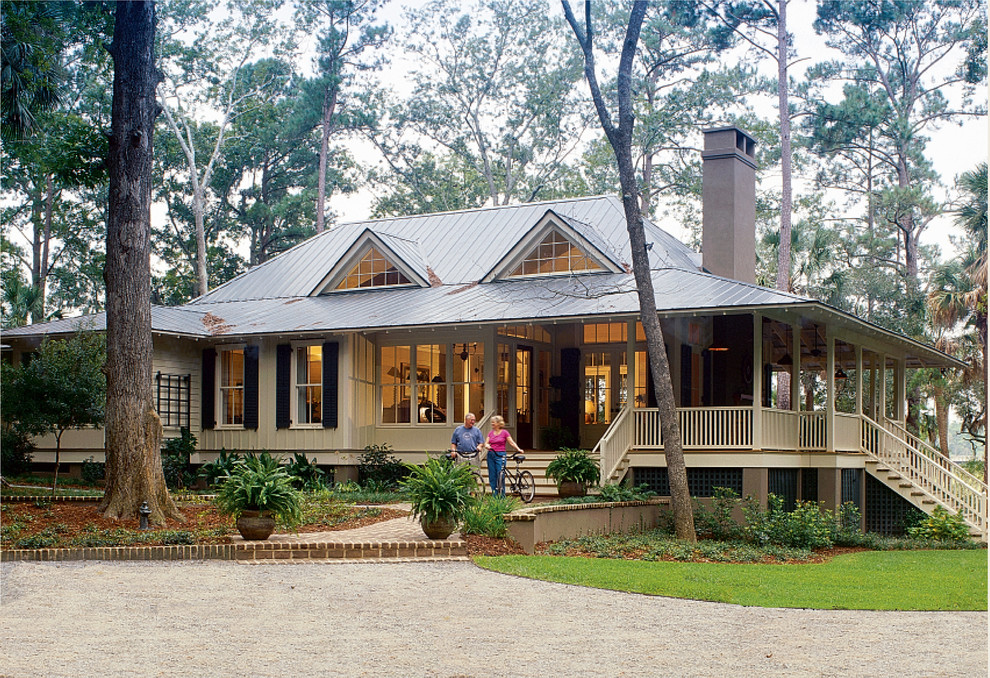 Design ideas for a beige beach style bungalow house exterior in Atlanta.