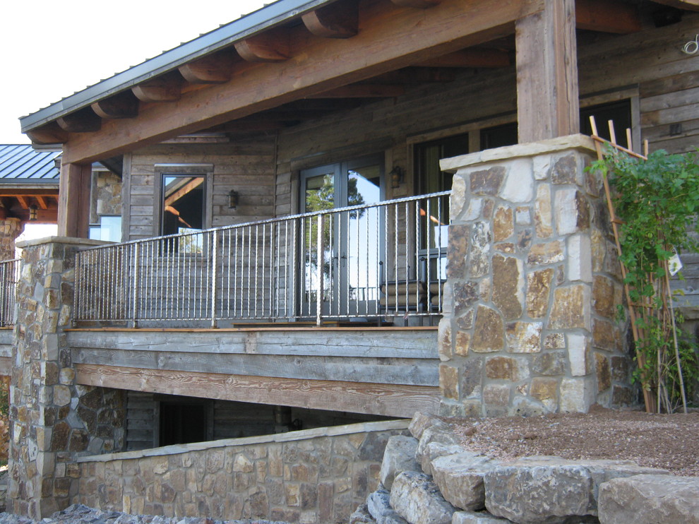 Example of a huge mountain style beige two-story mixed siding gable roof design in Phoenix