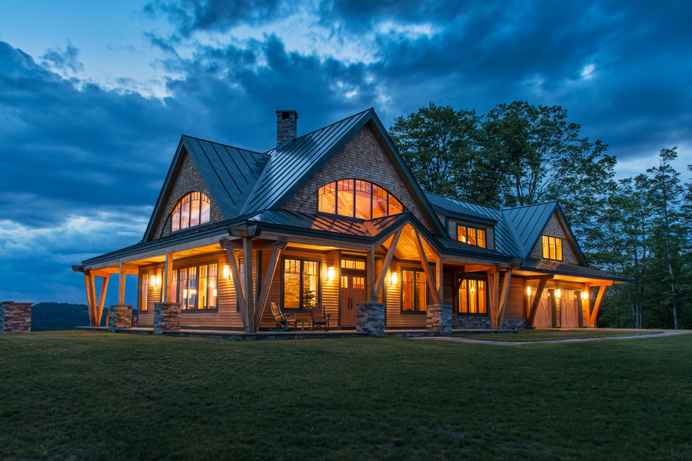 Photo of a rustic house exterior in Burlington with wood cladding.
