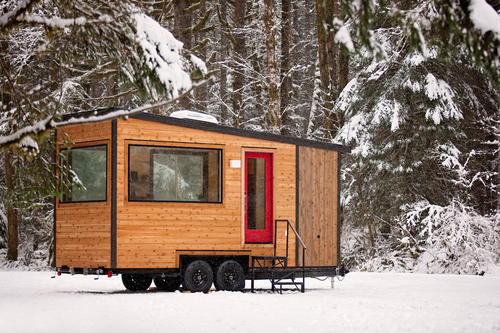 Inspiration for a rustic brown one-story wood tiny house remodel in Portland with a shed roof