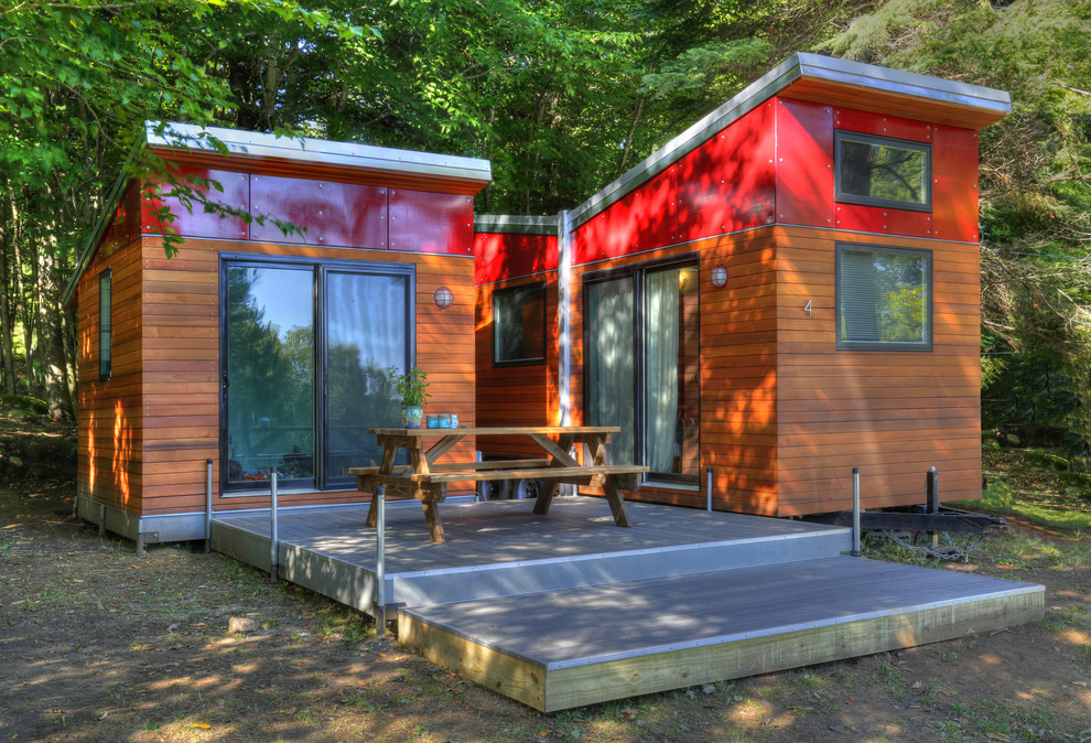 Inspiration for a small and red modern bungalow tiny house in New York with mixed cladding and a lean-to roof.