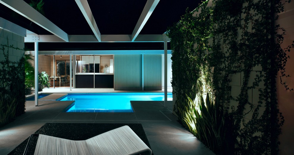 Cette image montre une façade de maison minimaliste de plain-pied.