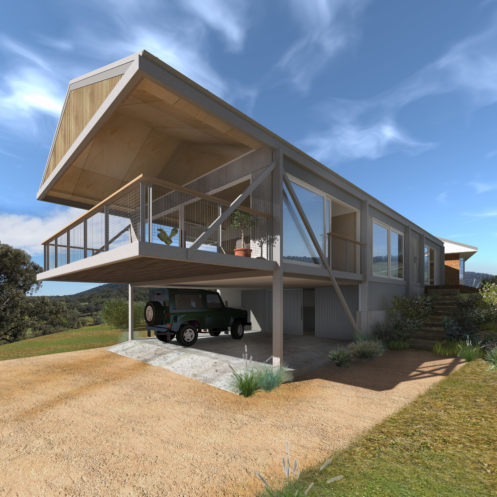 Ejemplo de fachada de casa contemporánea de tamaño medio de dos plantas con revestimiento de metal, tejado a dos aguas y tejado de metal
