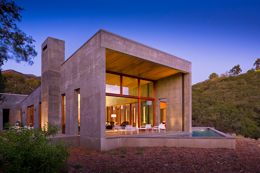 Example of a mountain style gray one-story concrete exterior home design in Santa Barbara