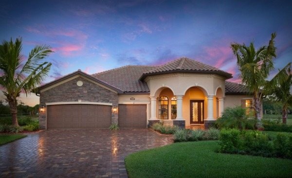 This is an example of a large and beige classic render detached house in Tampa with a tiled roof.