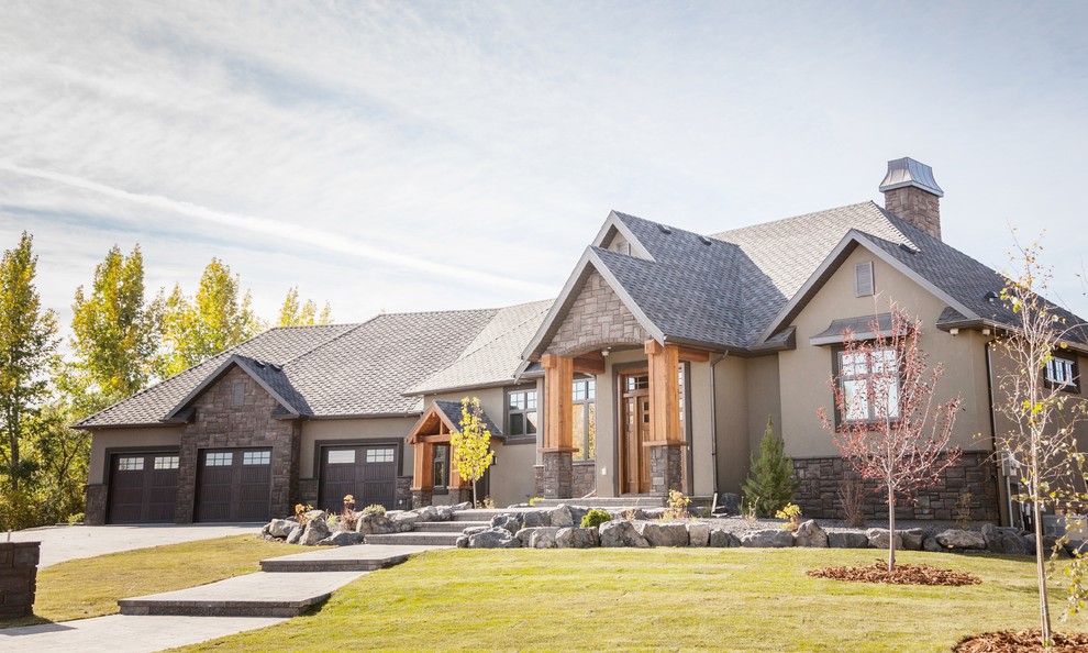 Design ideas for a large and brown classic bungalow house exterior in Calgary with mixed cladding.
