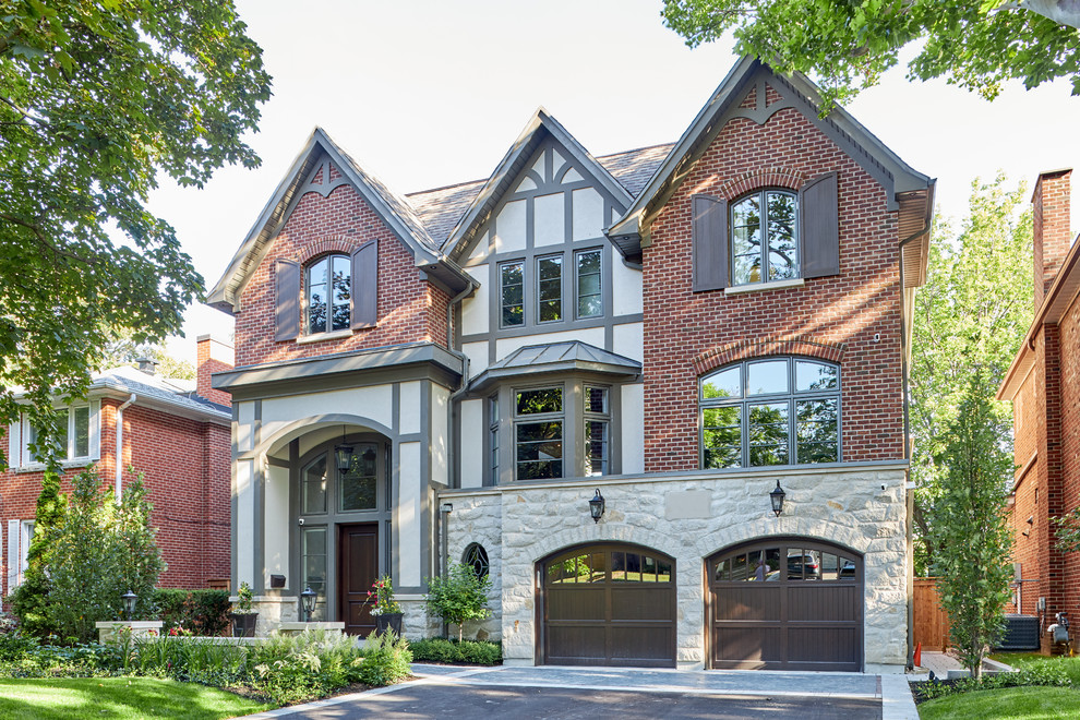 Design ideas for a multi-coloured classic two floor brick detached house in Toronto with a half-hip roof and a shingle roof.