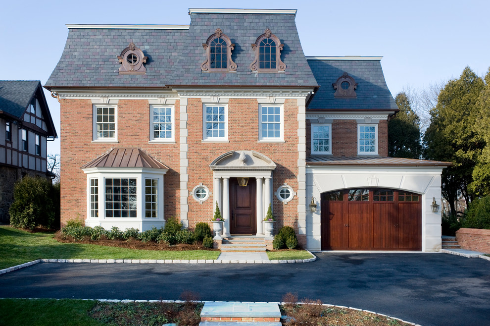 Inspiration for a large timeless red three-story brick house exterior remodel in New York with a hip roof and a shingle roof