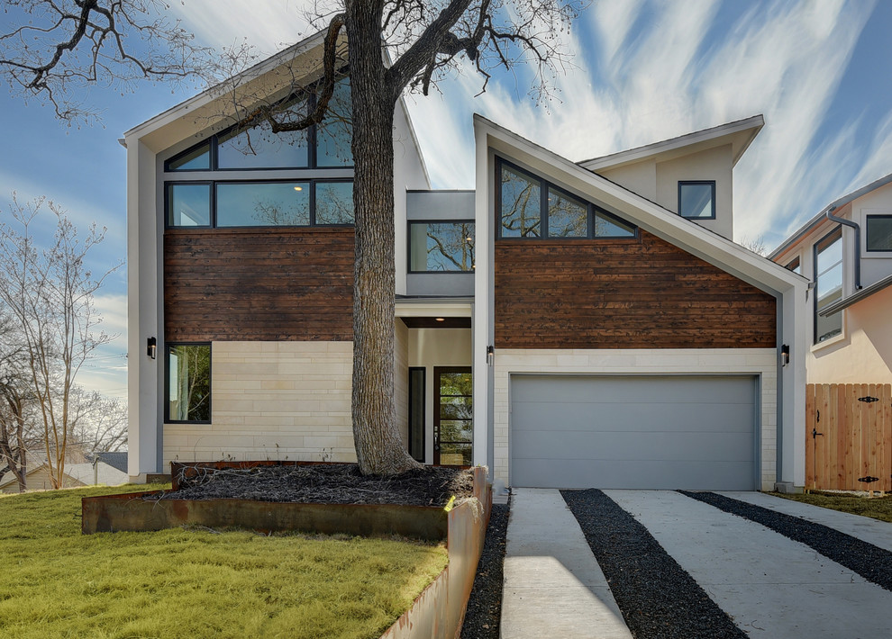 Zweistöckiges Modernes Haus mit Mix-Fassade, bunter Fassadenfarbe und Pultdach in Austin