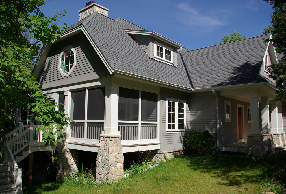 Mid-sized traditional gray two-story wood gable roof idea in Milwaukee