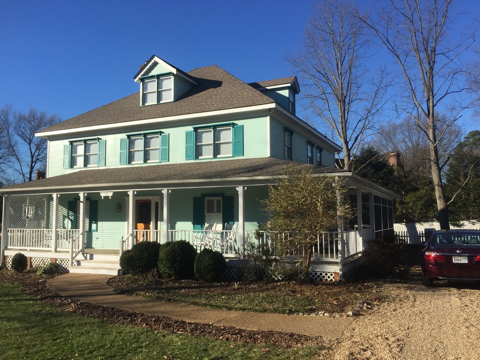Example of a large classic green three-story vinyl house exterior design in Richmond with a shingle roof and a hip roof