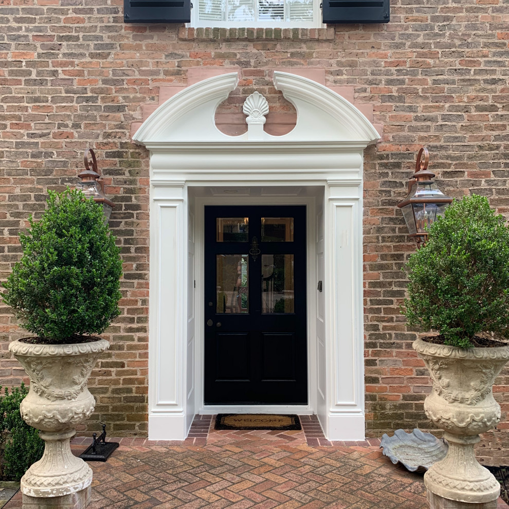 Traditional Brick Classic Home with White Trim and Black