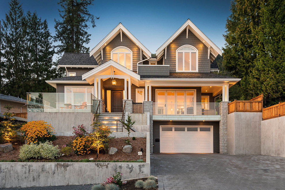 Inspiration for a gey and large traditional two floor detached house in Vancouver with wood cladding, a hip roof and a shingle roof.
