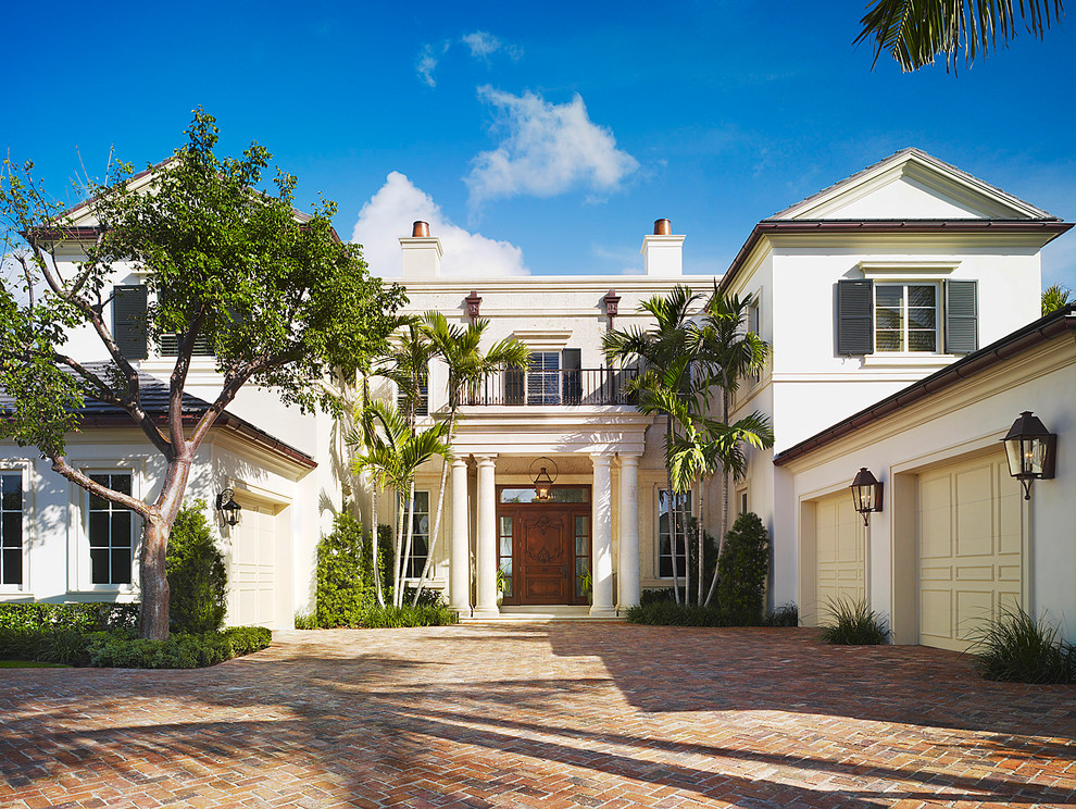 This is an example of a white classic two floor house exterior in Miami.
