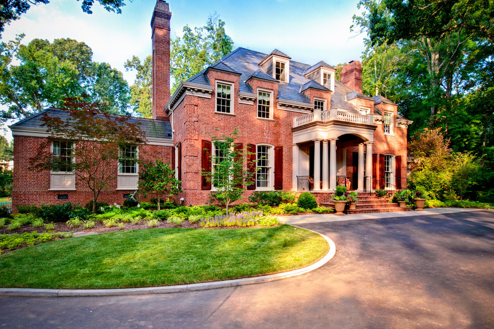 Design ideas for a traditional brick house exterior in Charlotte.