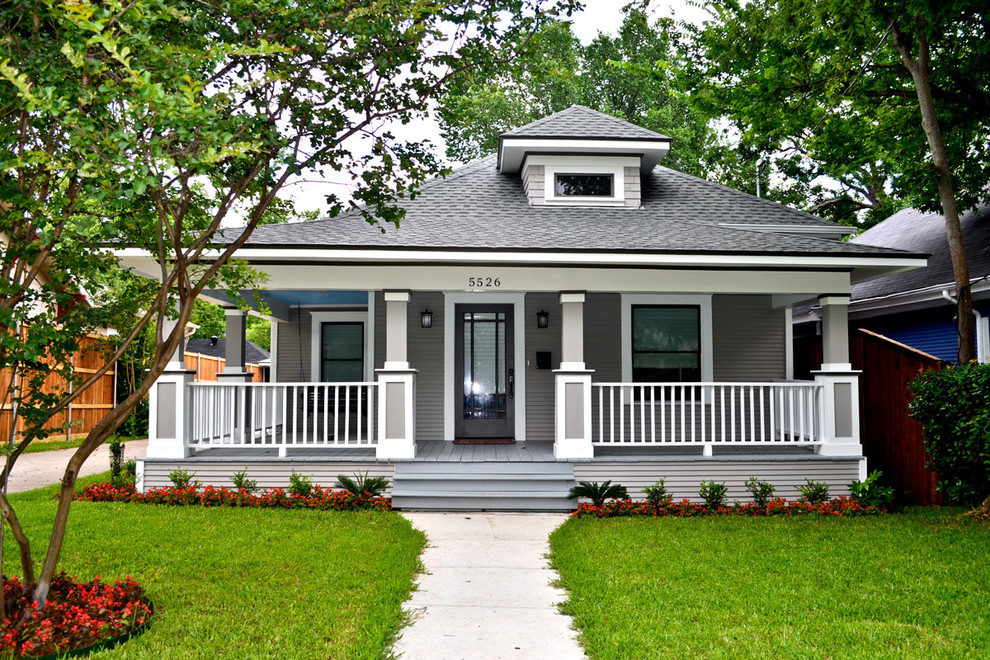 Traditional gray two-story exterior home idea in Dallas with a hip roof