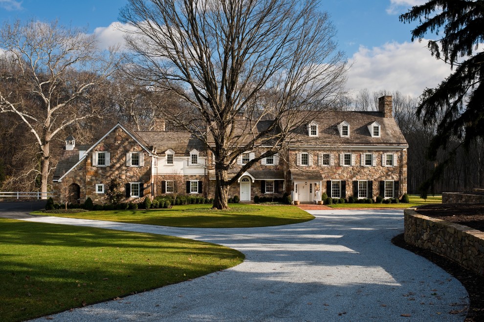 Inspiration for a large timeless stone exterior home remodel in Philadelphia
