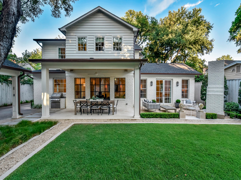 Inspiration for a timeless white two-story mixed siding exterior home remodel in Austin with a shingle roof