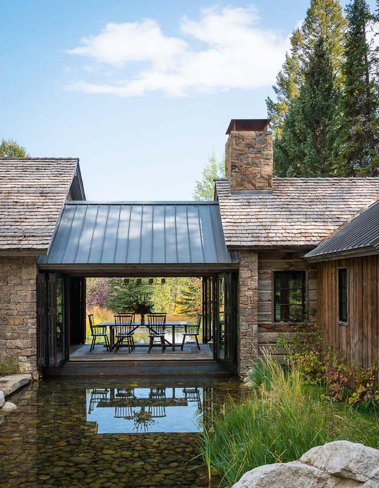 Inspiration for a rustic one-story mixed siding exterior home remodel in Other